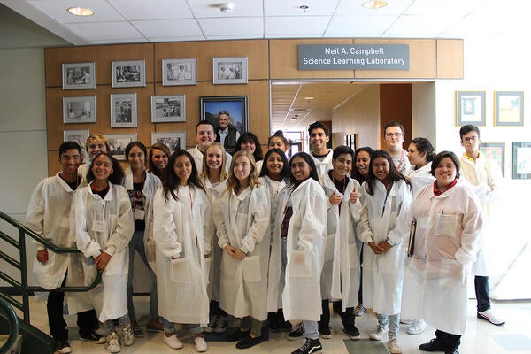 Students in front of the Neil A. Campbell Science Learning Laboratory